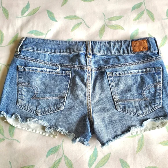 American Eagle High Waist Cut-Off Denim Shorts with Silver Glitter Star Pockets - Picture 6 of 9